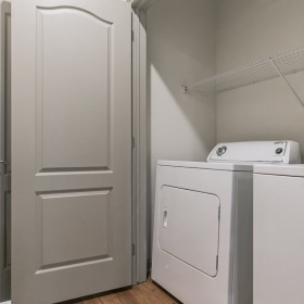 a closet with a washer and dryer