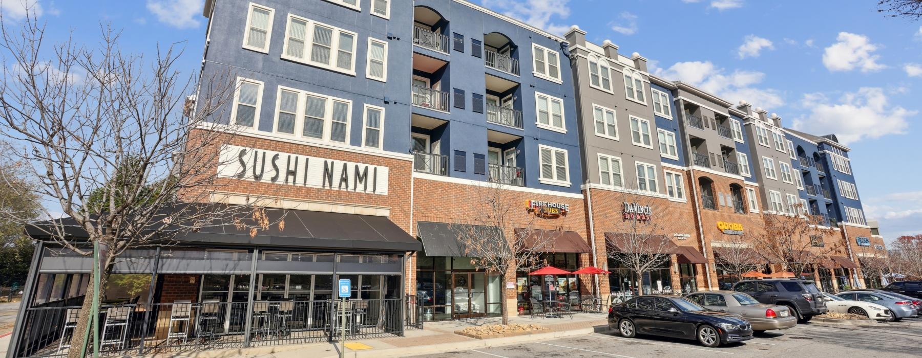 a building with cars parked in front